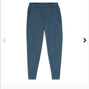 Never worn.  NWT mens large lululemon surge hybrid pant.
